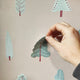 showing a wall sticker being peeled off